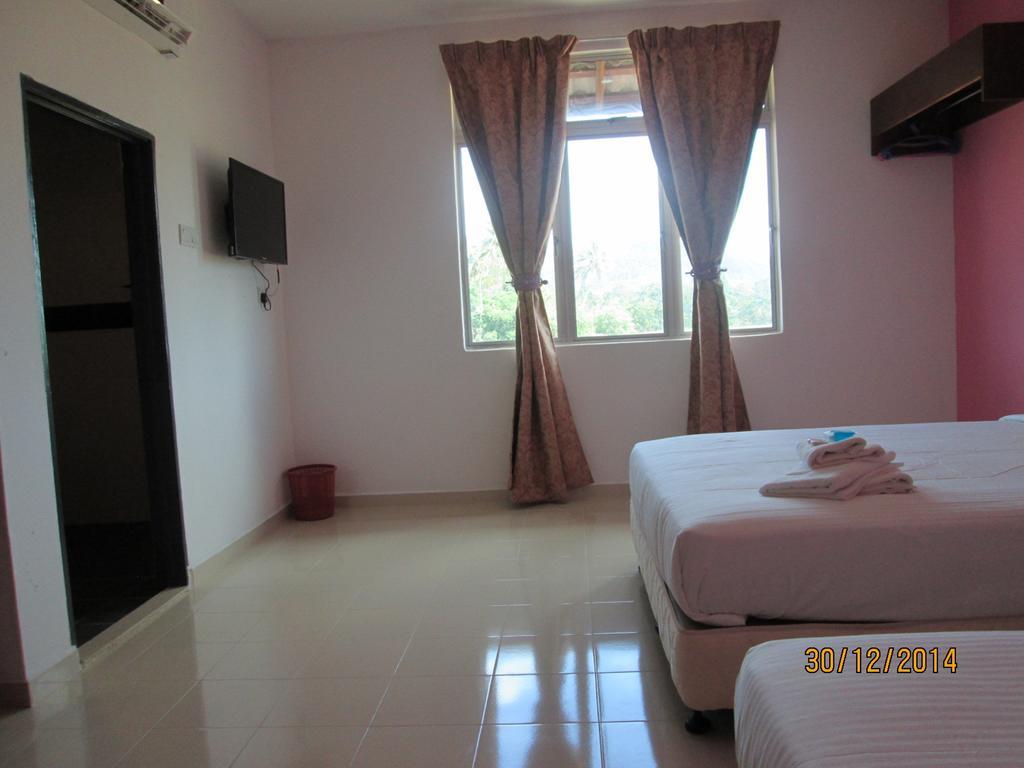 OYO 275 Senyum Inn Pantai Cenang  Zimmer foto