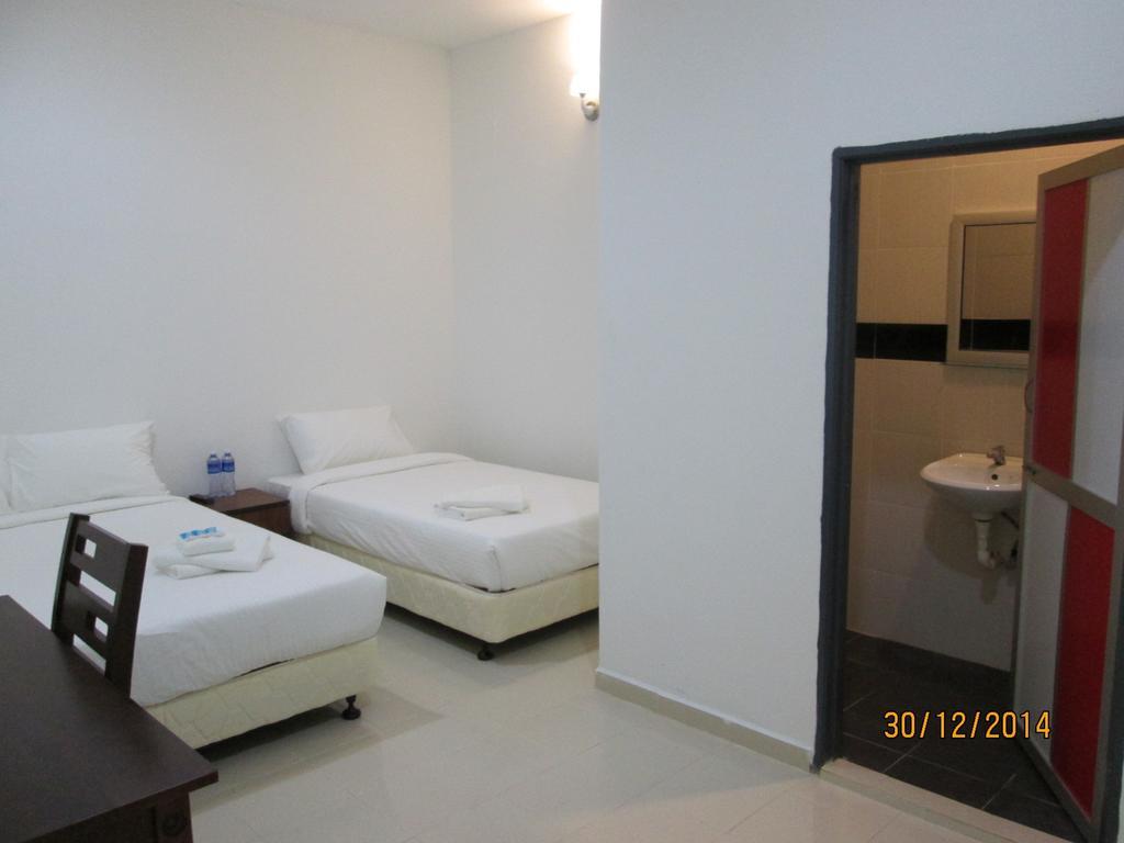 OYO 275 Senyum Inn Pantai Cenang  Zimmer foto
